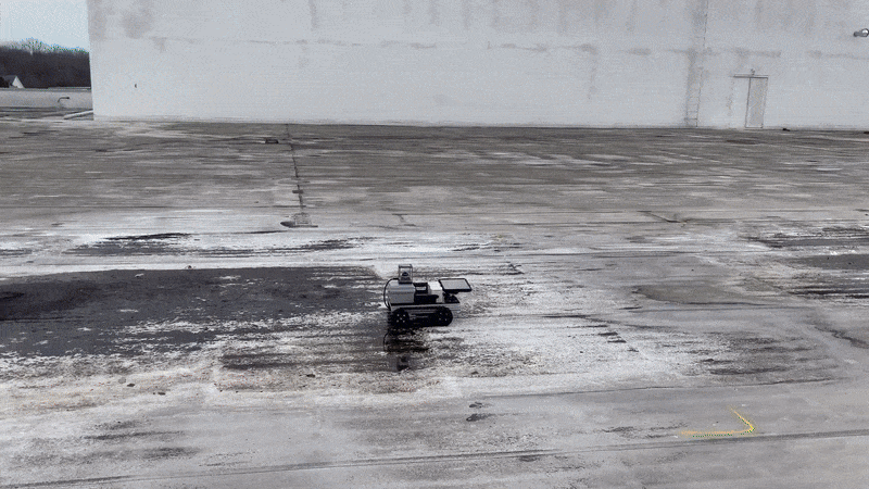 Roof inspection robot in action on a flat commercial roof